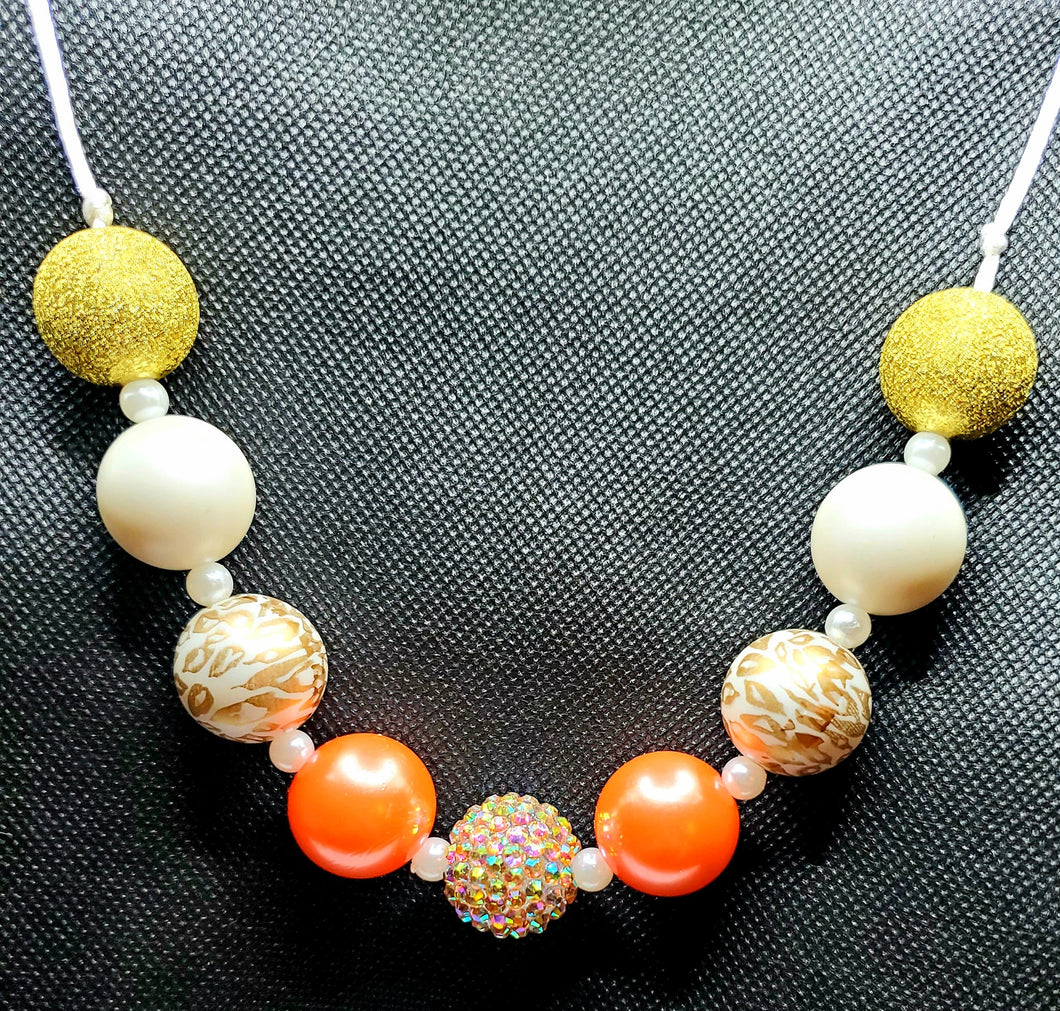 Orange, gold, animal print with pearl spacer beads